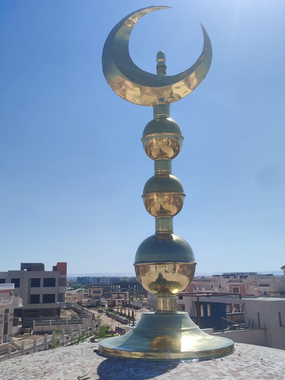 A brass crescent for the mosque To determine the direction of the Qiblah A crescent made of yellow brass